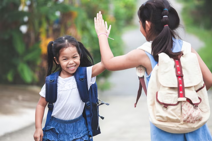 two sisters greeting each other before school