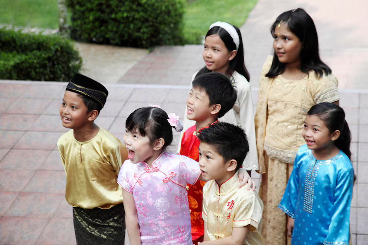 two children in traditional dress with their arms around each other