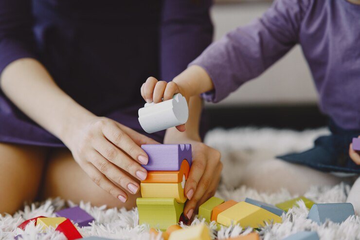 a child building shapes with blocks