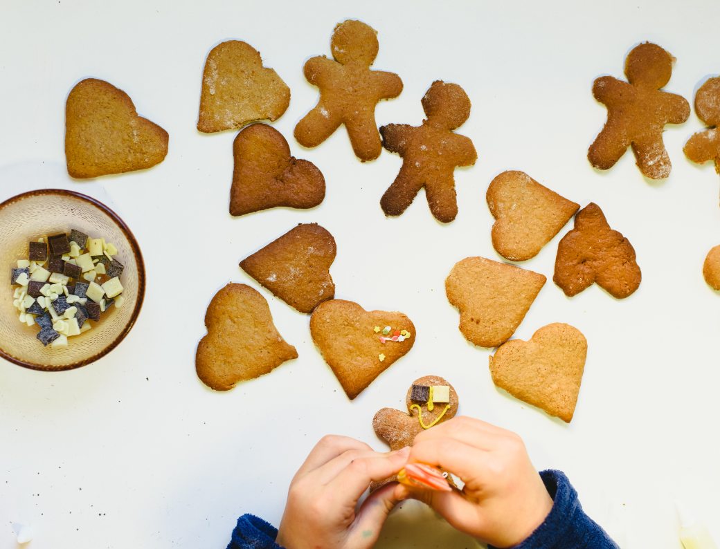 a child decorating biscuits
